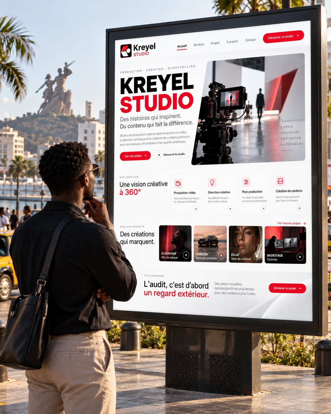 Un passant observe une affiche KREYEL Studio